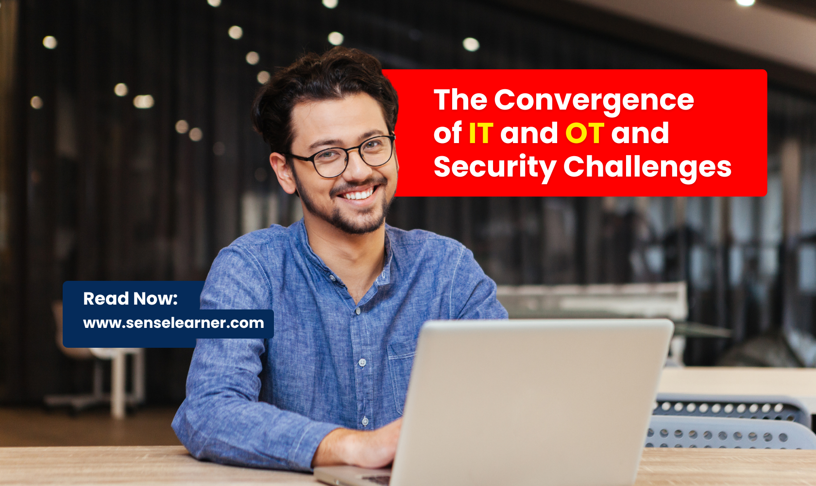 A professional working on a laptop, representing the convergence of IT and Operational Technology systems